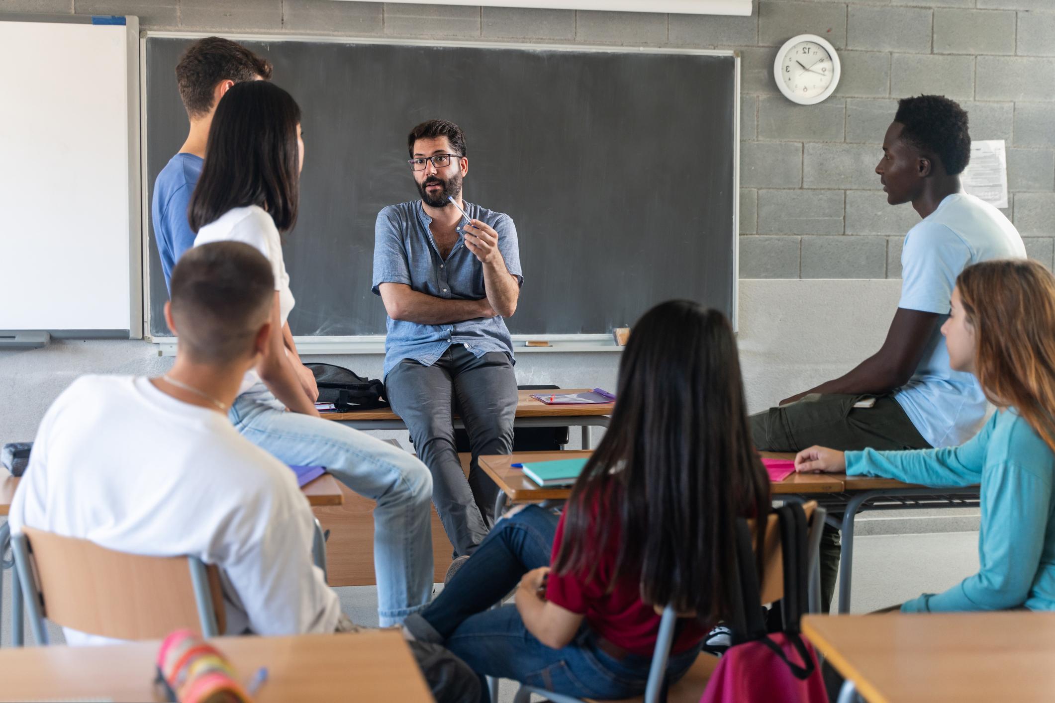 teacher talking to students